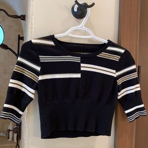 Striking cropped top! Bought this item in New York and loved it!